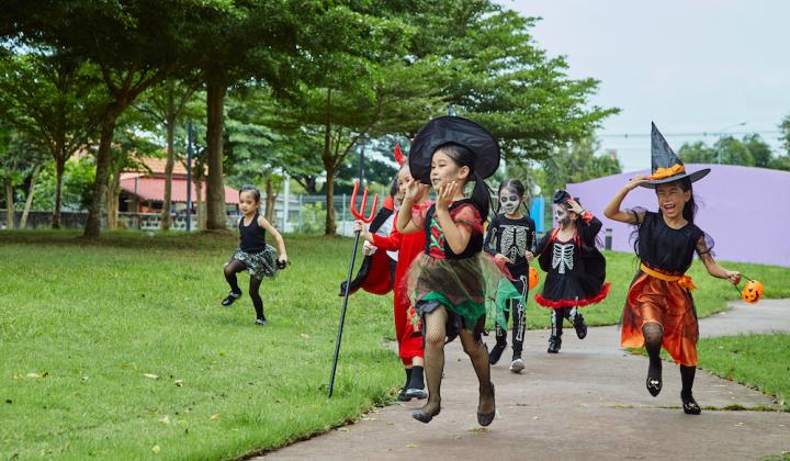 Kids running in halloween costumes 